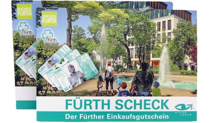Zwei Einkaufsgutscheine "Fürth Scheck" übereinander